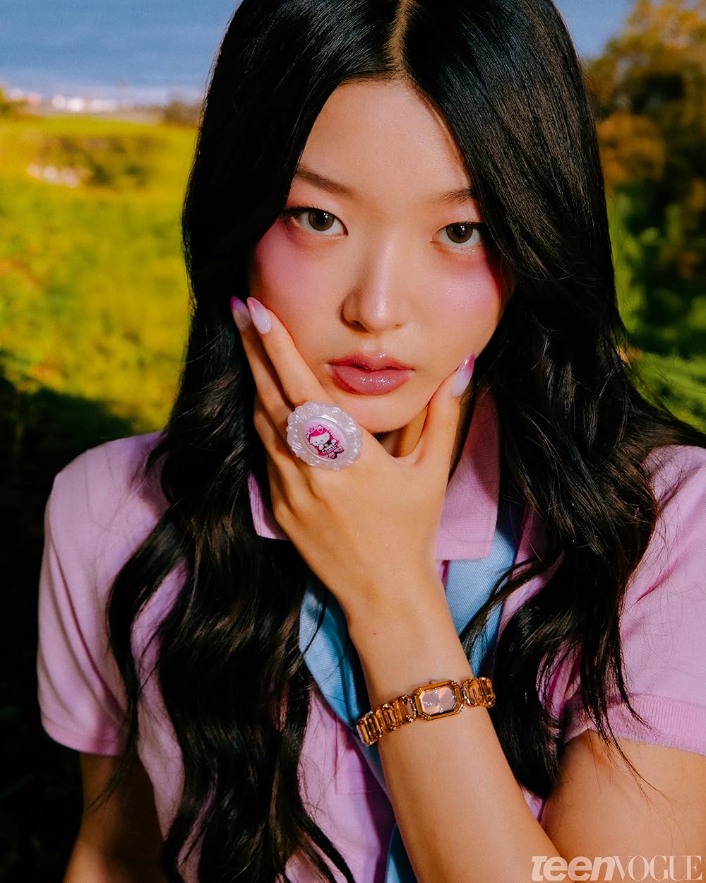 Young Korean woman with serene expression, teal-toned atmospheric studio portrait, dark background